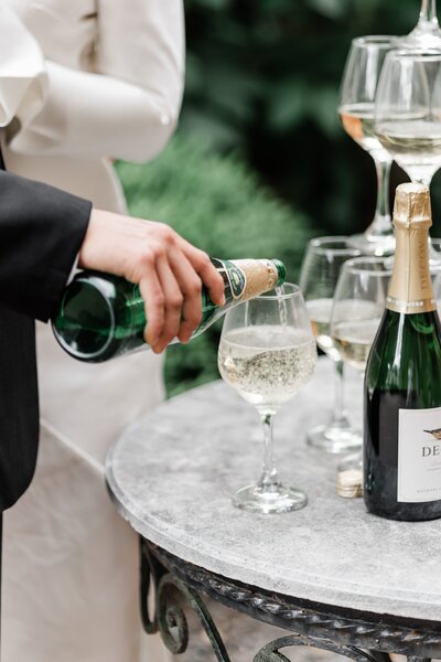 pouring a glass of champagne