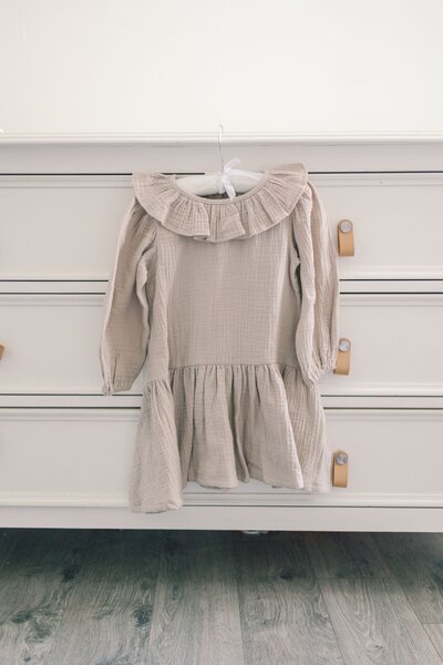Toddler dress in light gray.