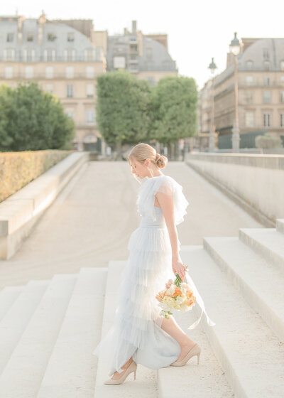 model walking down steps in paris photo session