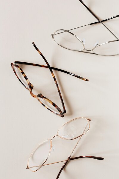 Eyeglasses sitting on white counter.