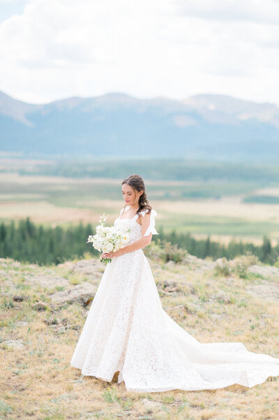 a cheerful bride spinning her dress for a beautiful must have bridal portrait at the sweetheart winery posing or wedding photography in colorado