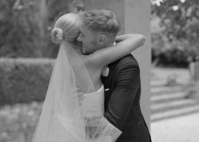Bride and groom sharing emotional first look before wedding ceremony, captured by Sasha Films