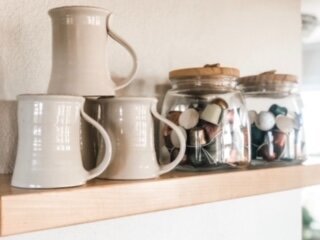 whote mugs on abbys shelf