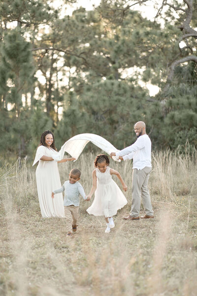 Family of 4 family session in Miami field with Ivanna Vidal Photography