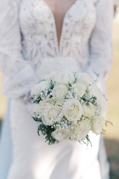 A bride & his groom lean in nose to nose on their wedding day. Taken at The Barn at Bridlewood at sunset.
