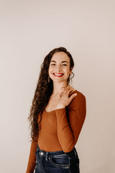 Image of woman in orange shirt