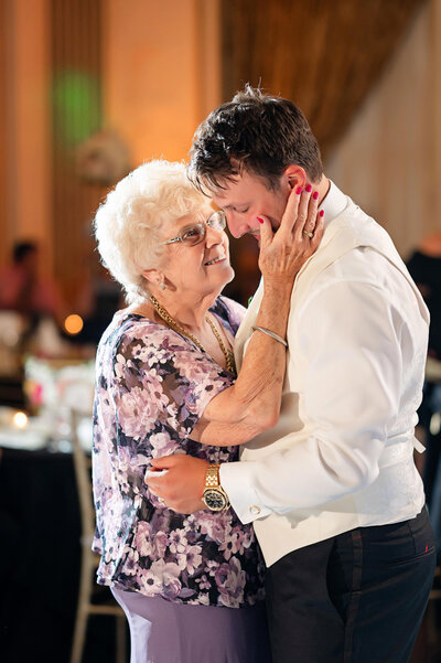 groom george washington hotel wedding candid moment with grandmother