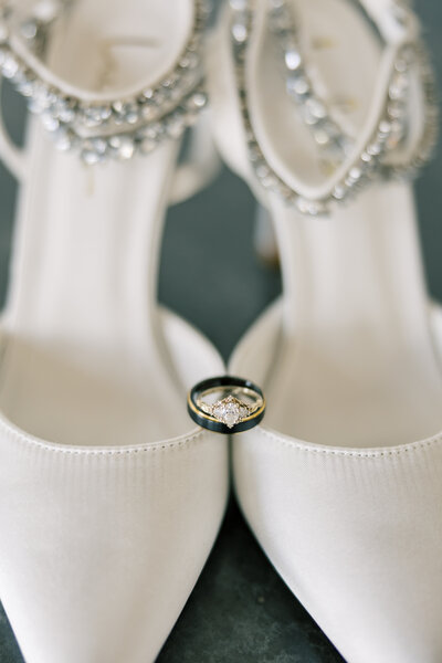 Wedding shoes with wedding rings.