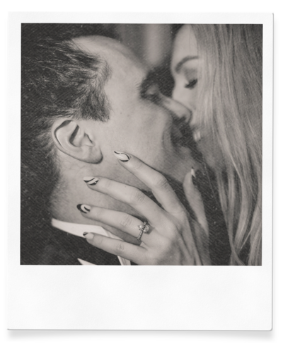 couple kisses during engagement session in las vegas