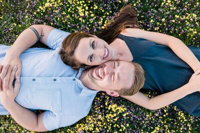 couple laying in the grass