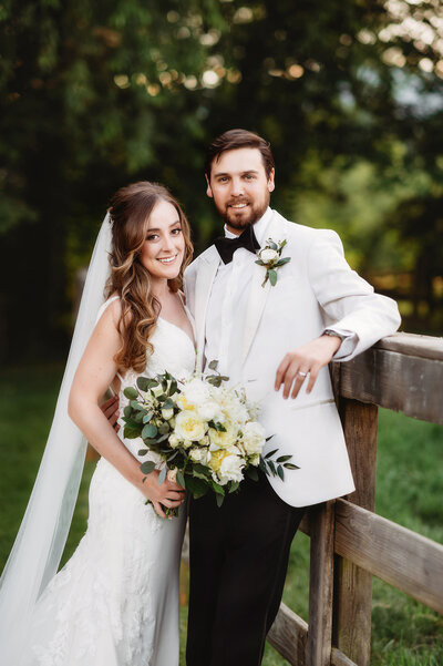 Newlyweds pose for portraits on their Micro Wedding Day at The Farm, A Gathering Place in Asheville, NC.