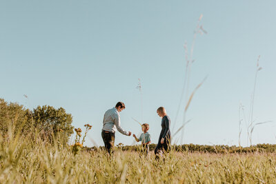 Candid Family Photography in the field at Assiniboine Forest