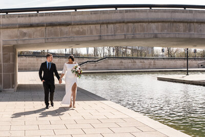 Couple walk along canal during elopement