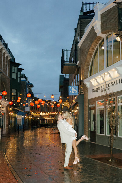 Bride and groom sharing a romantic kiss at their Chilliwack 1881 wedding venue, captured by Vintage Gem Photography.