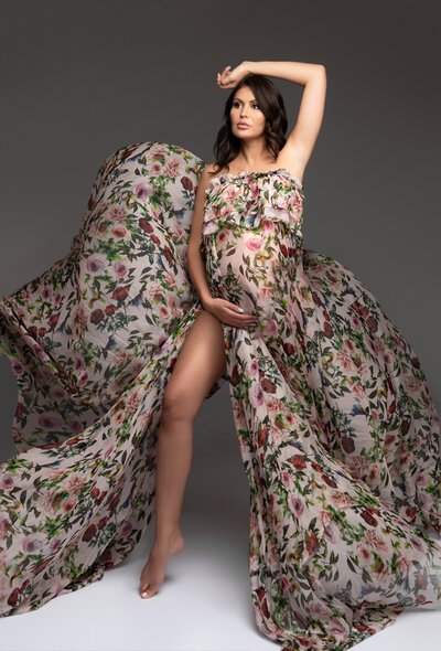 pregnancy photo with flying floral fabric