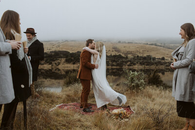 bride and groom eloping on a mountain in New Zealand