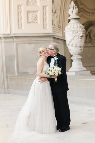 A couple posing on the north 4th floor of San Francisco City Hall