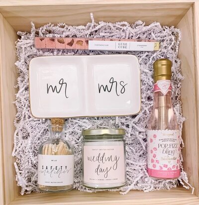 Box of wedding gifts by Xo & Mane, a feminine boutique based in St. Albert, featured on the Brontë Bride Vendor Guide.