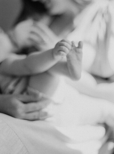 Baby touching foot taken by Denver Family Photographer