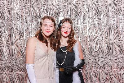 2 girls posing against a bohemian backdrop, for a 18th birthday party entertainment using the Selfie pod party photo booth