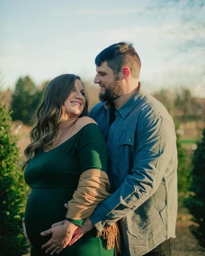 A couple embracing during their Lehigh Valley maternity photography session.