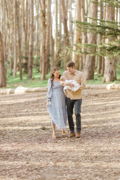 Bay Area woods, couple holding their newborn