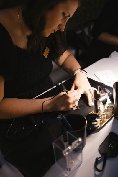 Live engraver engraving glassware at Scottsdale wedding