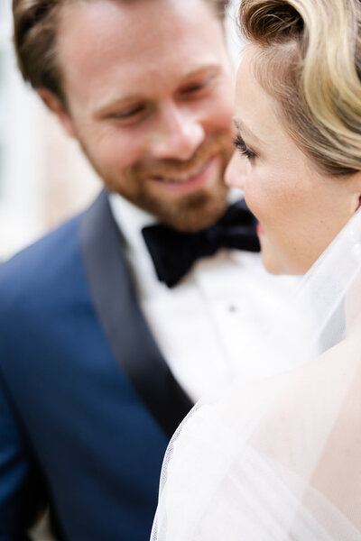 close up of bride and groom smiling  on wedding day in Ohio captured by The Cannons Photography