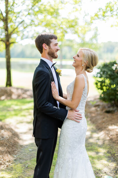 Bride and groom posing at outdoor wedding in Alabama
