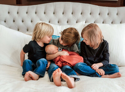 three-brothers-meeting-new-baby