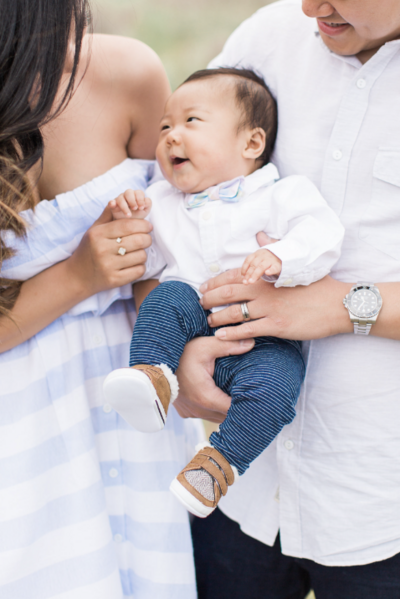 A smiling baby during a spring mini session in Denver
