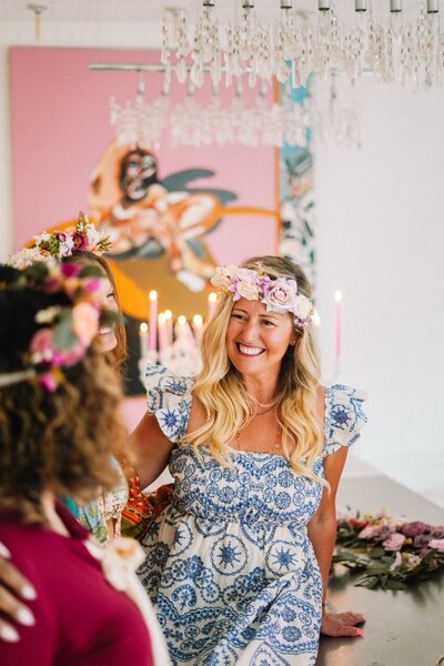 Katie, founder of Mystical Living, laughing with clients, fostering connection and joy on their spiritual journey.