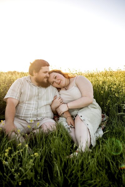a engaged couple in the wild flowers in plano
