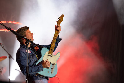 Musician holding his electric guitar