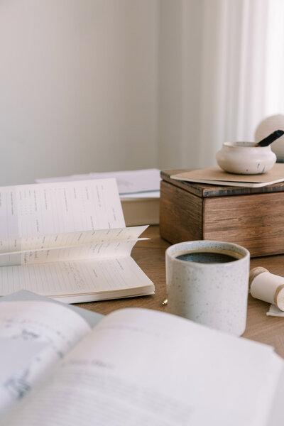 Open planner and cup of coffee on a desk