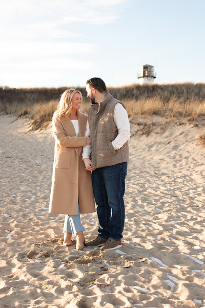 engagement photo of couple on beach in cape cod dancing