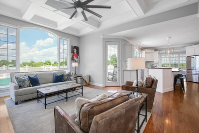 A professionally captured living room shot for real estate photography. The image showcases the space's layout and design, highlighting key features to attract potential buyers with its inviting and well-composed presentation.