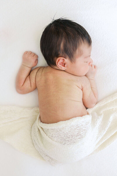 Newborn sleeping on tummy at studio by newborn photographer in the bay area