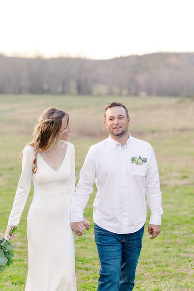 Bride looking at groom as they walk