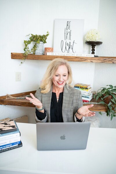 professional woman talking to a client on zoom call personal branding photography session wichita, KS