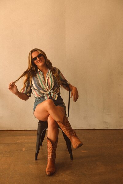 Family and Wedding Photography, Casey Tharpe Headshot sitting against tan backdrop