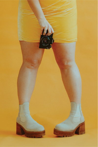 yellow-dress-and-camera@2x