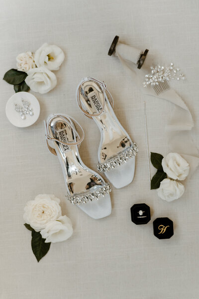 wedding shoes with accessories and flowers