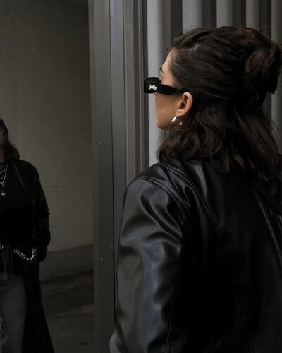 Woman wearing black and Jelly sunglasses