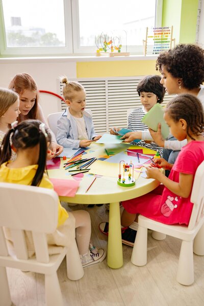 primary school children in classroom sitting at table