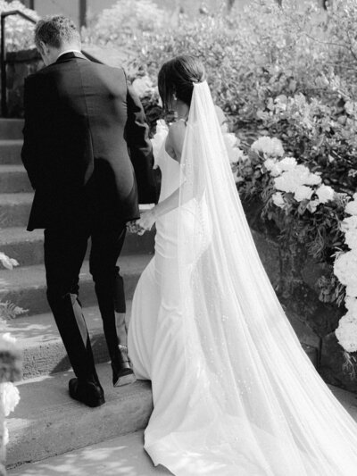 Bride and groom exit wedding ceremony on the lawn at Tetherow Resort for luxury wedding in Bend, Oregon