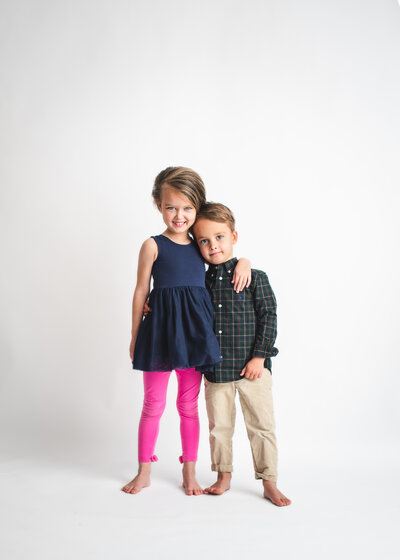 two kids family photo in a studio