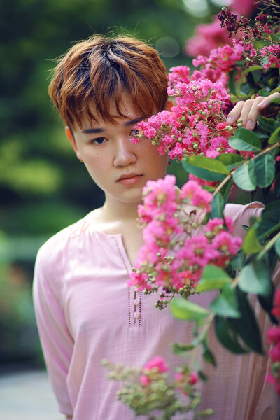 male posing with pink flowers in albany ny