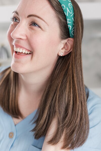 Close up of military spouse photographer with pi earrings