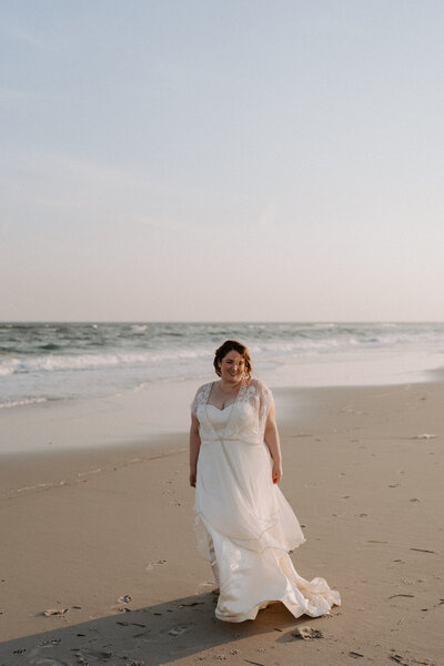 bride standing on the beach